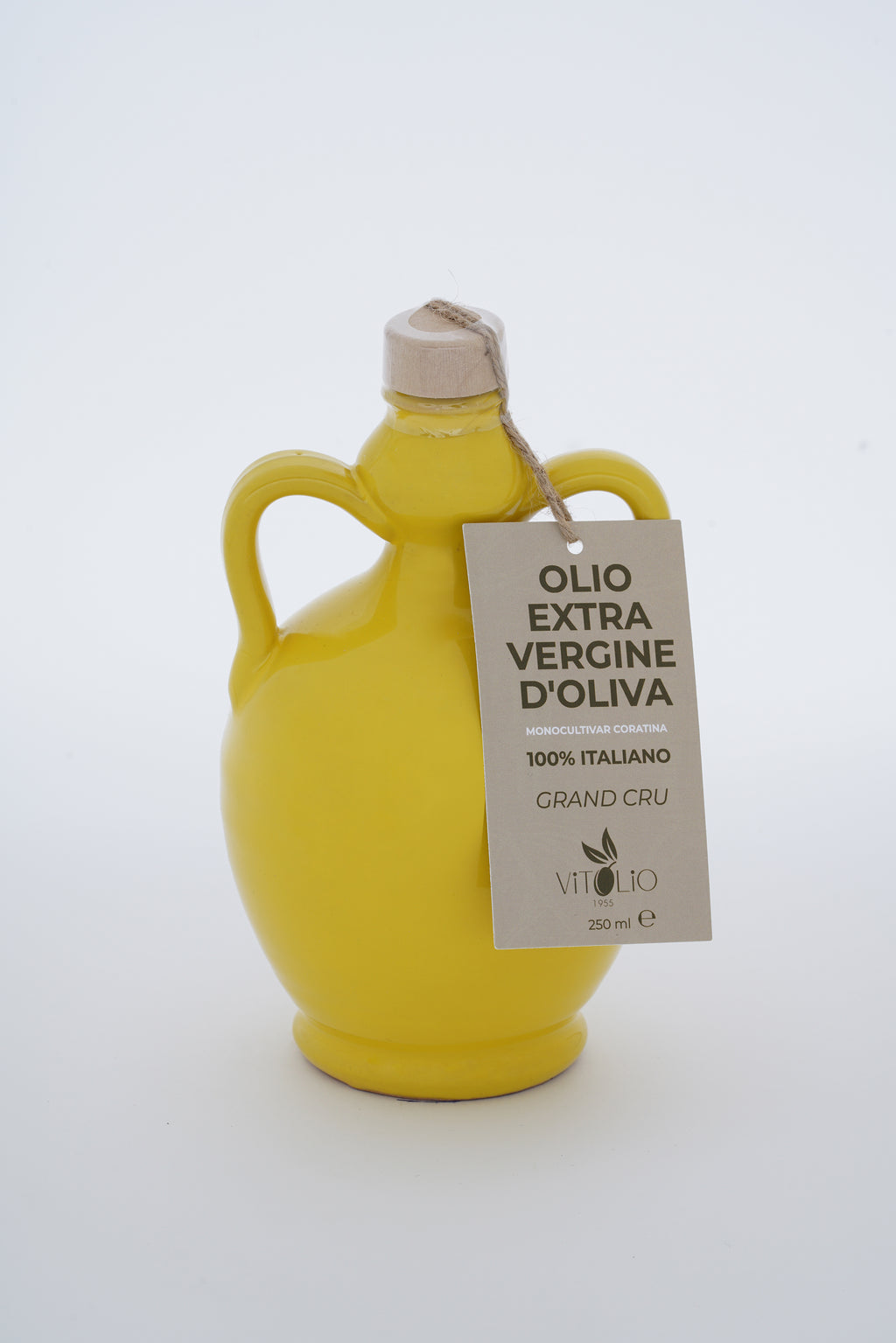 Bottiglia di ceramica gialla con Olio Extravergine di Oliva etichetta vintage italiana